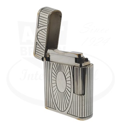 Preowned Vintage S.T. Dupont Soubreny 019105-D1 palladium lighter with Sun Medallion guilloche design and visible wear.