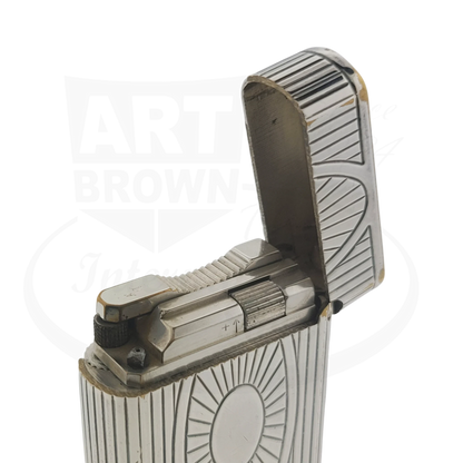 Preowned Vintage S.T. Dupont Soubreny 019105-D1 palladium lighter with sun medallion engraving and visible wear.