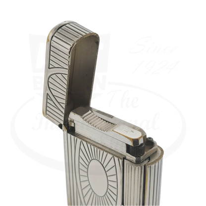 Preowned Vintage S.T. Dupont Soubreny 019105-D1 palladium lighter with Sun Medallion and chipped plating detailing