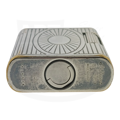 Preowned Vintage S.T. Dupont Soubreny 019105-D1 palladium lighter with Sun Medallion, visible wear, vertical fluting design.