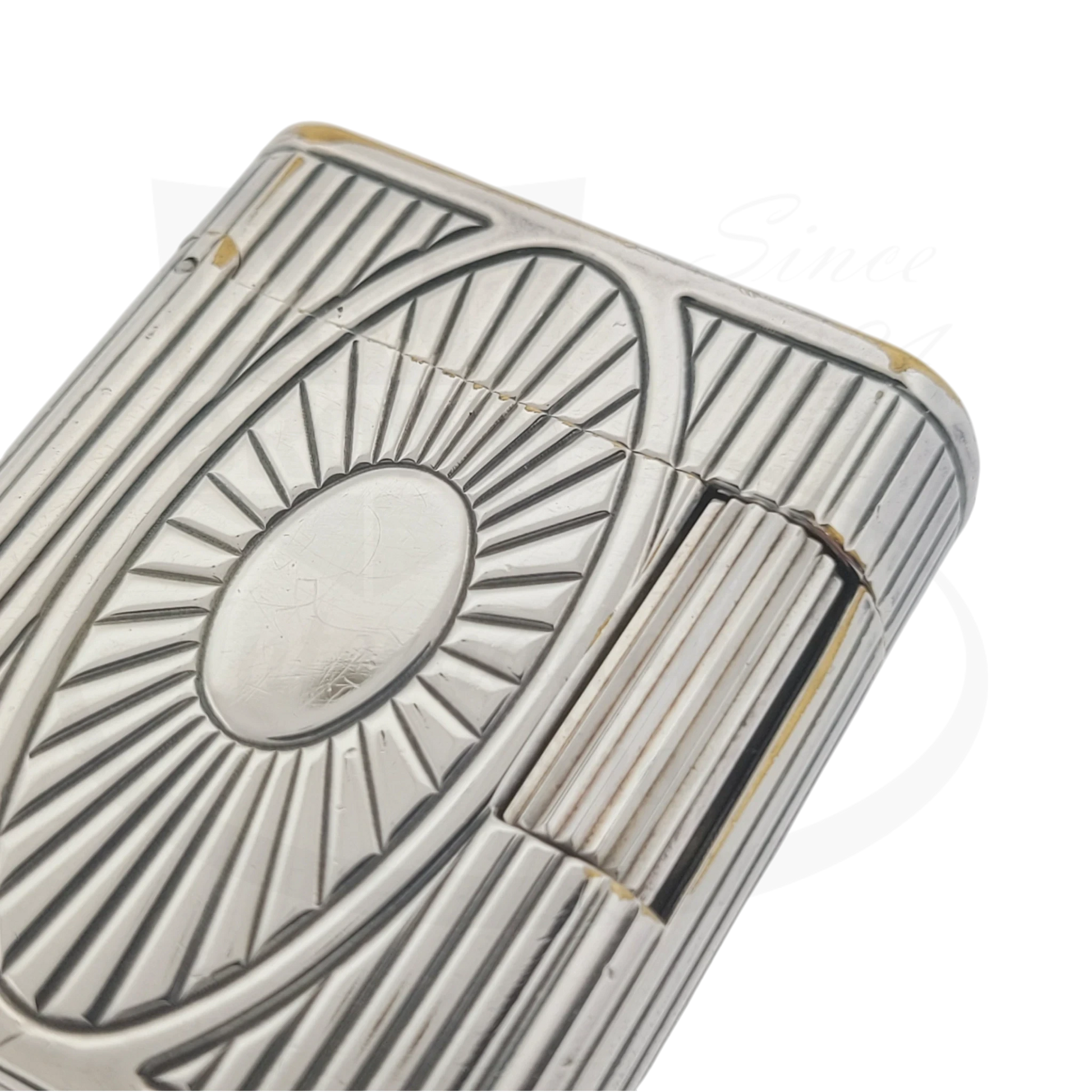 Preowned Vintage S.T. Dupont Soubreny 019105-D1 palladium lighter with sun medallion guilloche and visible wear