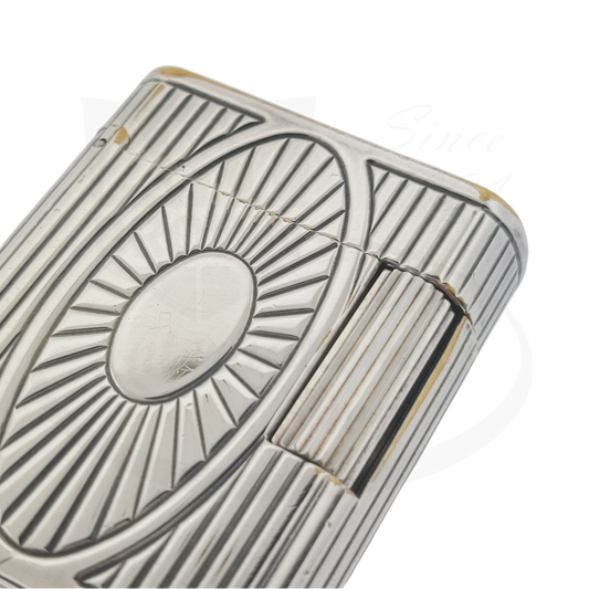Preowned Vintage S.T. Dupont Soubreny 019105-D1 palladium lighter with sun medallion guilloche and visible wear