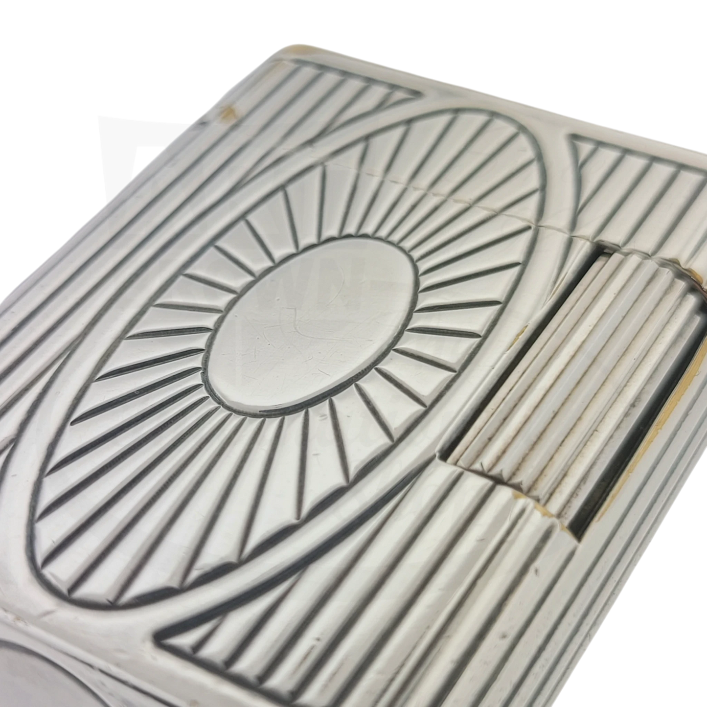 Preowned Vintage S.T. Dupont Soubreny 019105-D1 palladium lighter with sun medallion and vertical fluting, showing wear