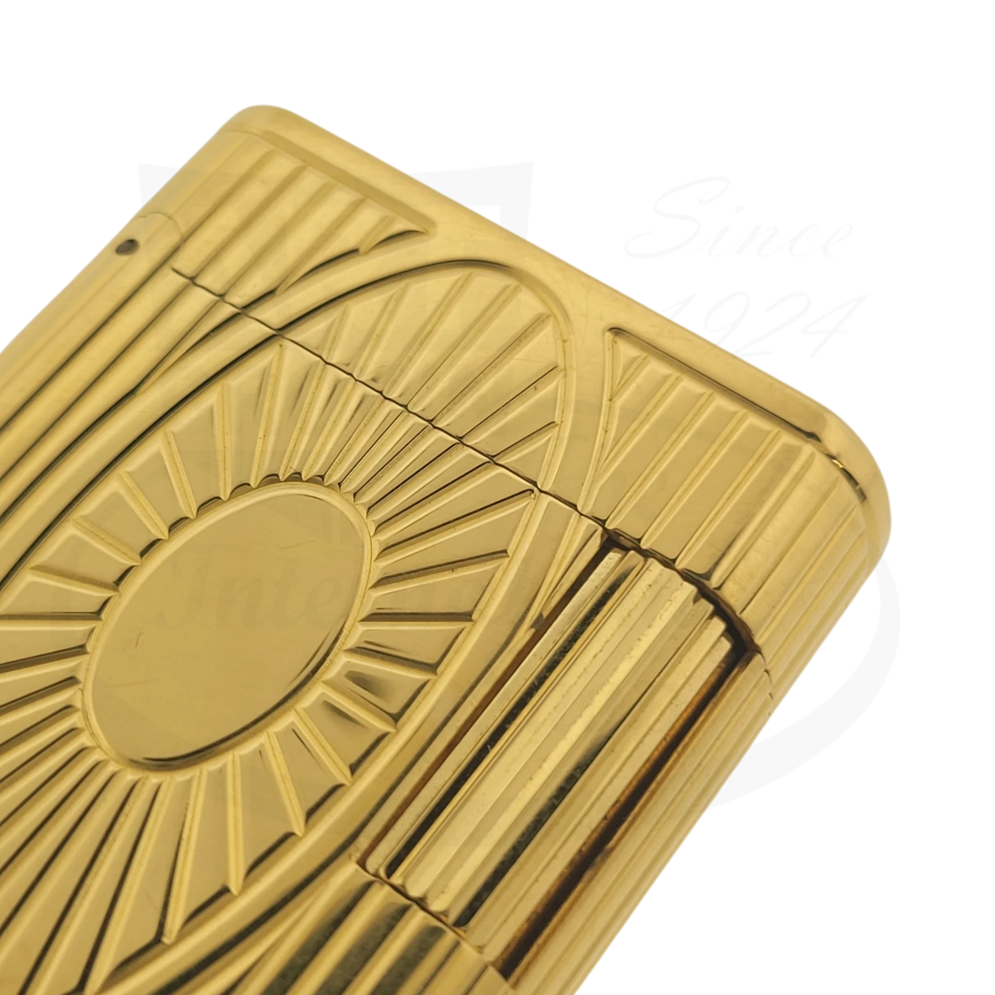 S.T. Dupont Soubreny 019205-D1 gold plated lighter with guilloche sun medallion pattern and vertical fluting details