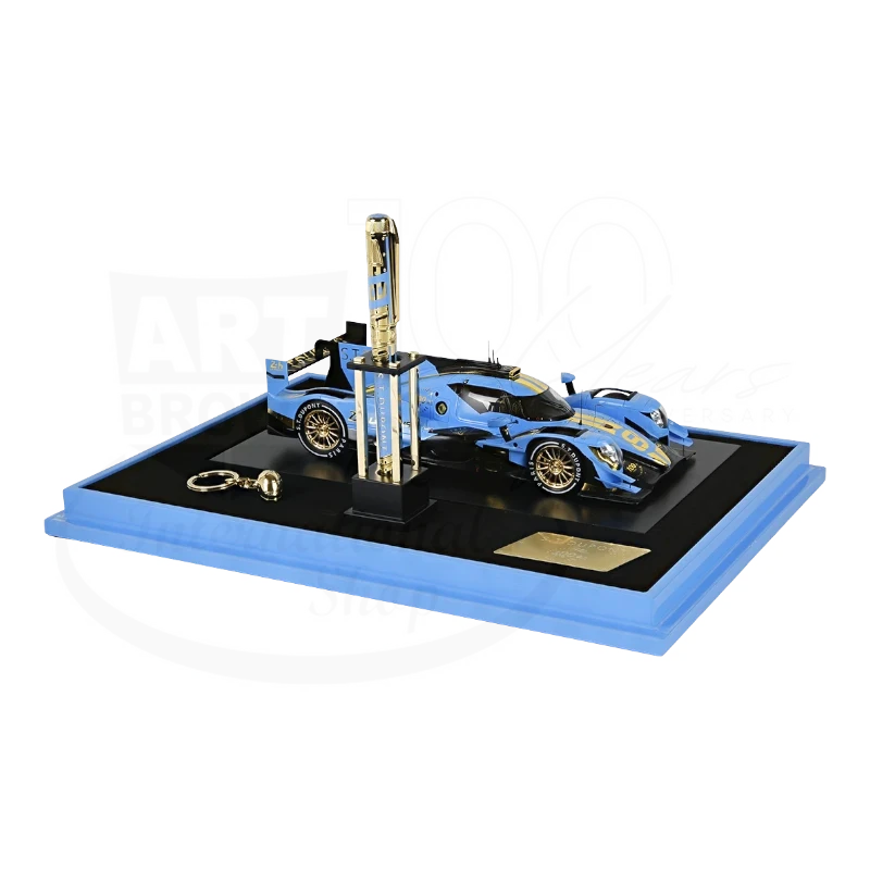 Luxury blue racing car model with a matching pen displayed on a sleek black and blue base collection set
