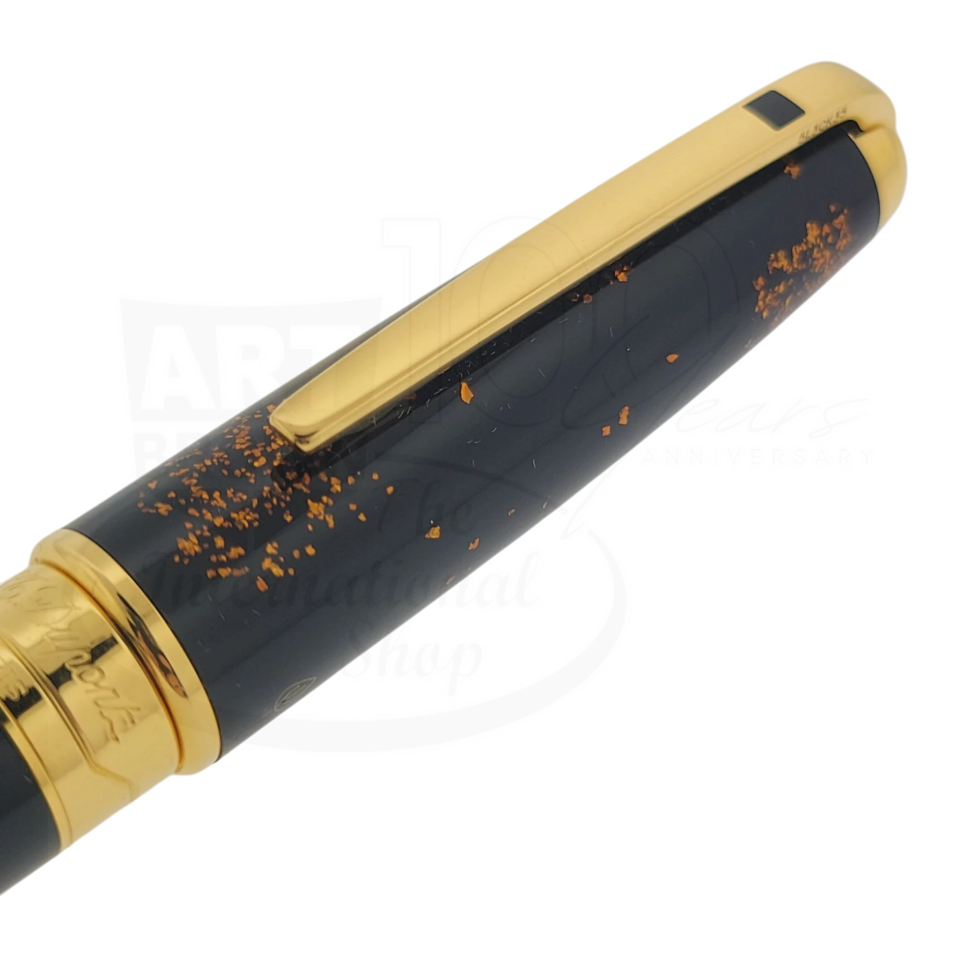 S.T. Dupont Olympio 482590 large rollerball pen with black lacquer and scattered gold dust accents, polished gold clip