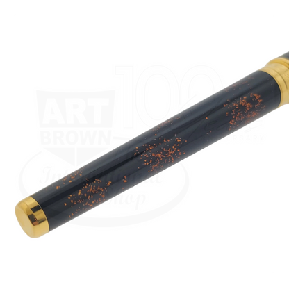 S.T. Dupont Olympio 482590 rollerball pen with black lacquer, scattered gold dust accents, and polished gold trim close-up