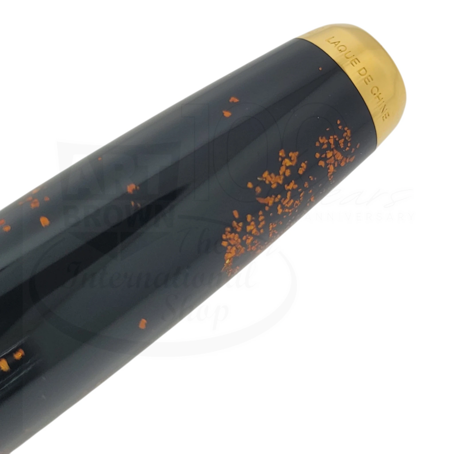 S.T. Dupont Olympio 482590 rollerball pen with black lacquer and gold dust speckled finish, gold cap trim close-up