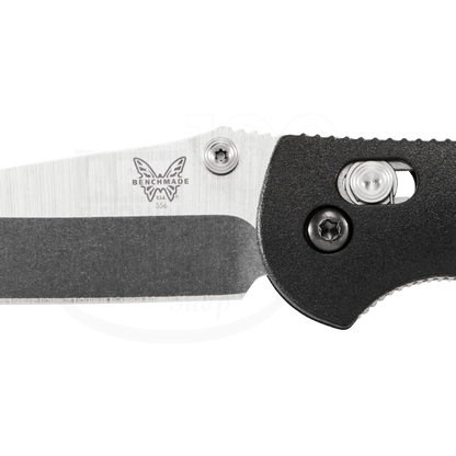 Benchmade Mini Griptilian® Grivory® Drop-point close-up of black textured handle and stainless steel blade lock mechanism detail