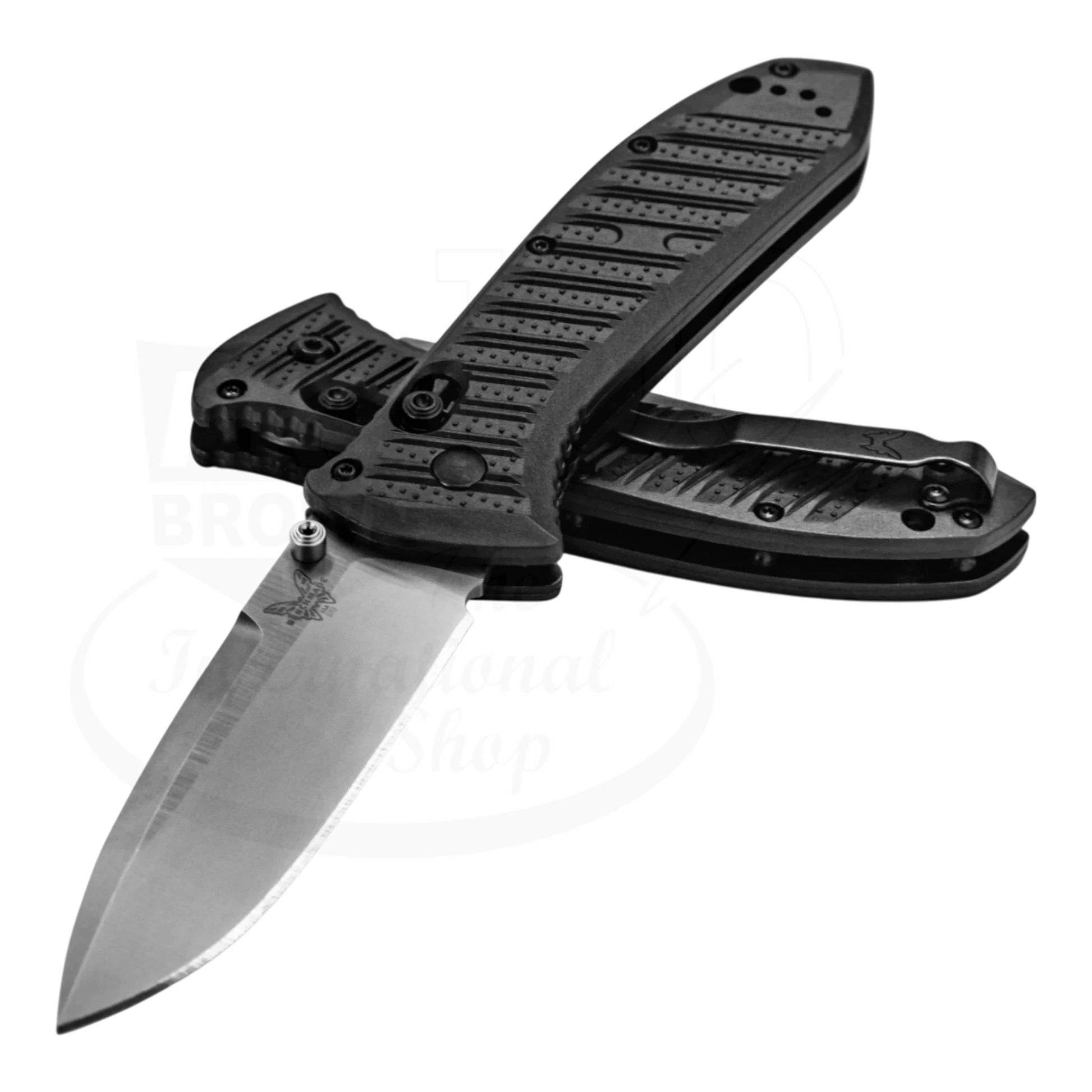 Benchmade Presidio® II CF-Elite® Drop point knife with sleek S30V steel blade and ergonomic textured handle open against 