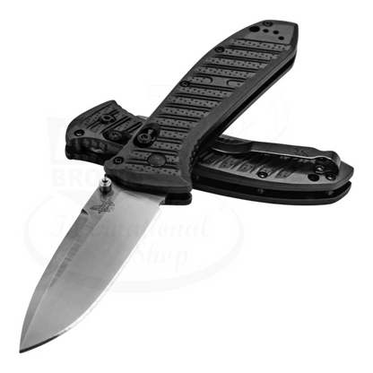 Benchmade Presidio® II CF-Elite® Drop point knife with sleek S30V steel blade and ergonomic textured handle open against 