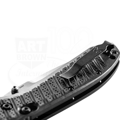 Benchmade Presidio® II CF-Elite® Drop point folding knife close-up with textured handle and branded clip