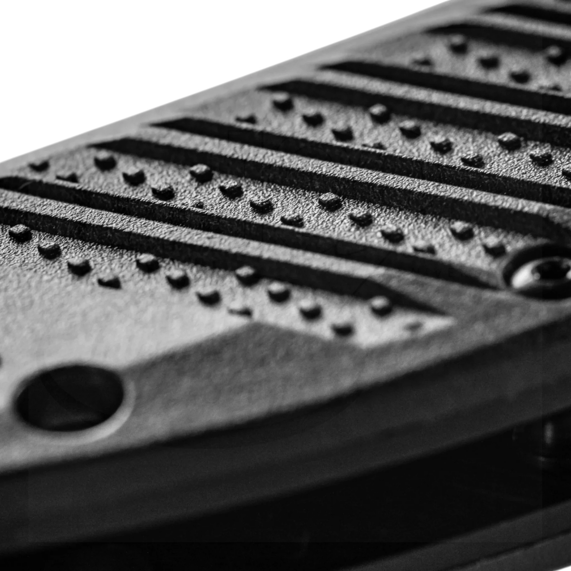 Close-up of textured handle detail in black on the Benchmade Presidio® II CF-Elite® Drop point