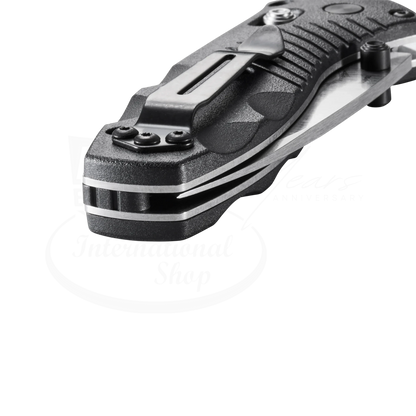 Benchmade Mini-Barrage® Black Valox® Assist Drop Point knife showing textured handle with pocket clip and blade spine detail