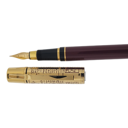 Preowned Aurora Limited Edition Leonardo Da Vinci Fountain Pen with gold cap featuring engraved script and burgundy barrel luxury pen