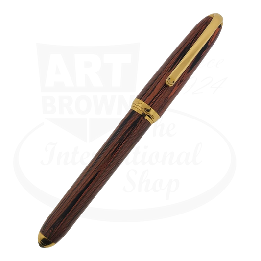 Cartier Dandy 0644/1847 red woodgrain fountain pen with 18K gold medium nib and gold trim accents, featuring vintage styling and elegant barrel design