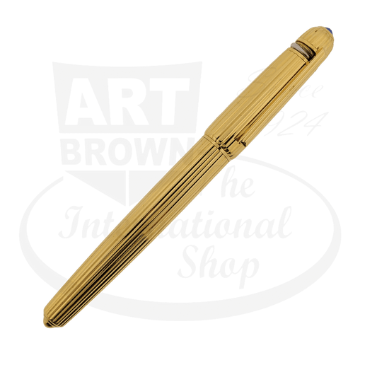 Cartier Pasha gold-plated fountain pen with ribbed barrel design, sapphire-accented tip, and 18K fine point nib in classic cylindrical shape