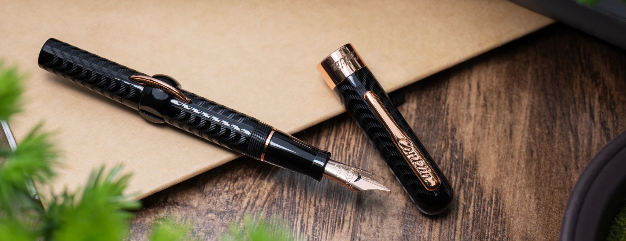 Conklin Crescent filler fountain pen with stainless steel rose gold nib, black textured barrel, and rose gold accents