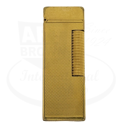 Dunhill Anomalies lighter with gold plating and barley grain design seen from the front.