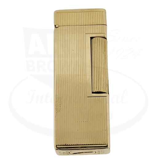 Dunhill Rollagas vintage petrol lighter with 14K gold jacket featuring vertical line pattern, rectangular shape, preowned condition