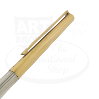 Close up detail of the cap and clip of two-tone S.T. Dupont classique ballpoint pen.