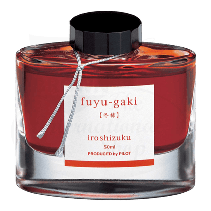 Pilot Iroshizuku Fuyu-gaki fountain pen ink in glass bottle, vibrant persimmon-red color, 50ml capacity with black screw cap and white label