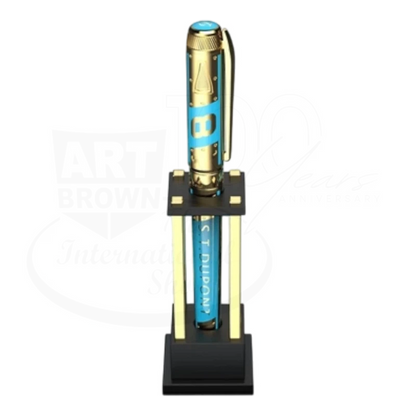 Luxury blue and gold fountain pen with engraved details, showcased on an elegant black and gold stand