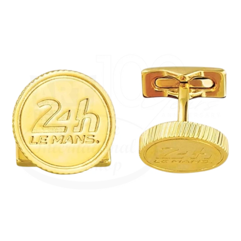Gold-tone cufflinks engraved with 24h Le Mans logo, showcasing sleek luxury and classic design details.