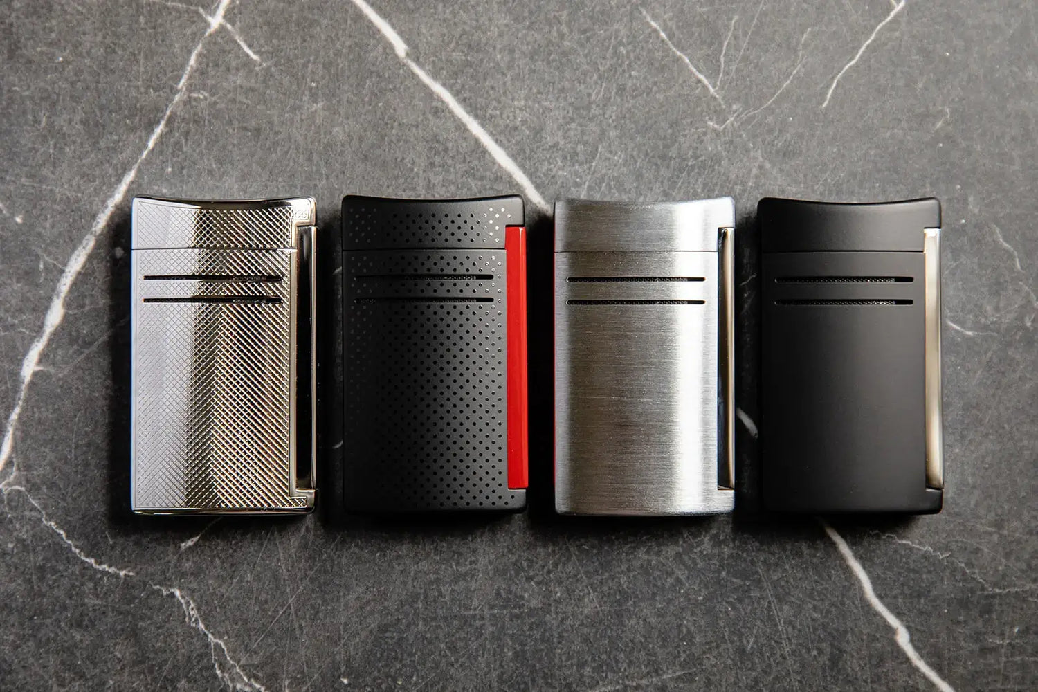 S.T. Dupont chrome grid, punched black, gunmetal and matte black maxijet luxury cigar torch lighters.