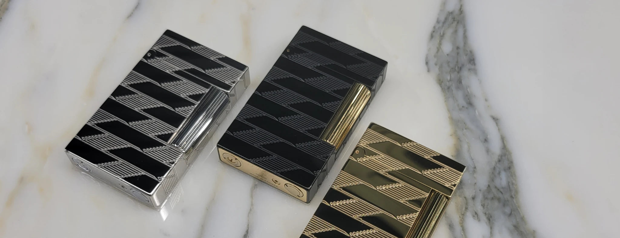 S.T. Dupont ligne 2 Monogram 1872 lighters in black, gold and palladium finish