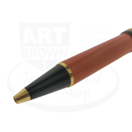 Montblanc Hemingway Writers Edition ballpoint pen in orange resin with black cap and gold-plated trim, showing writing tip detail