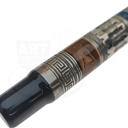 Close-up of a luxury fountain pen with intricate metal and wood detailing and a black glossy mouthpiece