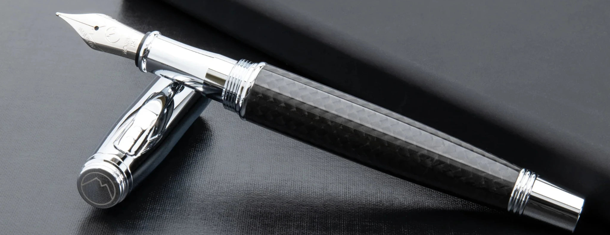 Monteverde Invincia fountain pen with stainless steel nib, carbon fiber barrel and shiny chrome accents