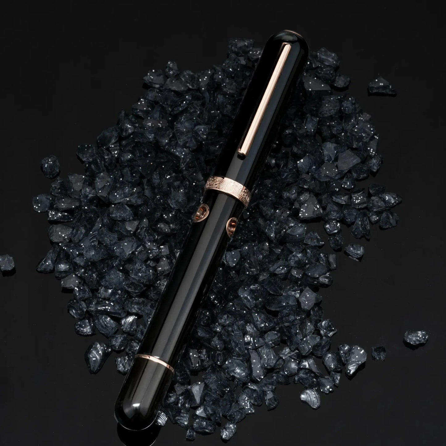 Nahvalur Nautilus Cephalopod Rose Gold Medium Fountain Pen, ebonite body, rose gold trim, porthole ink windows.