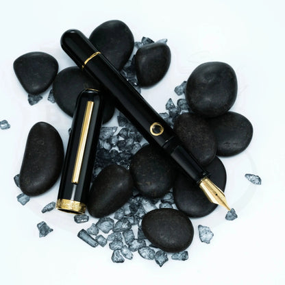 Nahvalur Nautilus Cephalopod Gold Medium Fountain Pen black resin body gold trim with stainless steel nib on stones