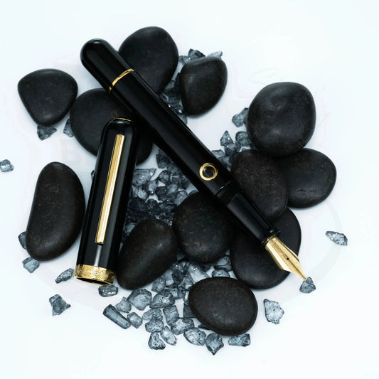 Nahvalur Nautilus Cephalopod Gold Medium Fountain Pen black resin body gold trim with stainless steel nib on stones