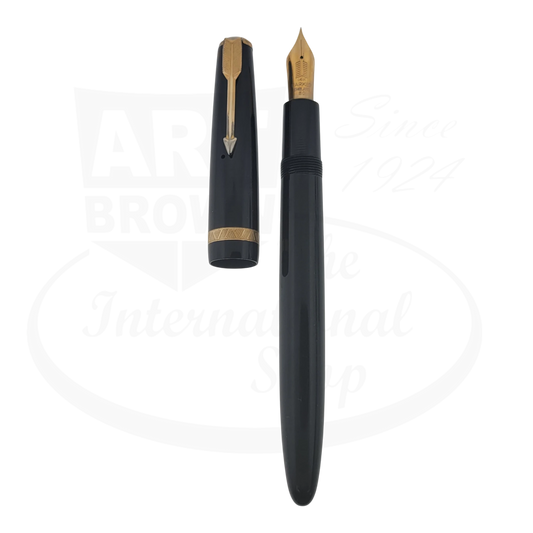 Parked Maxima Duofold 14K nib black resin fountain pen with gold trim and cap, preowned condition with marks