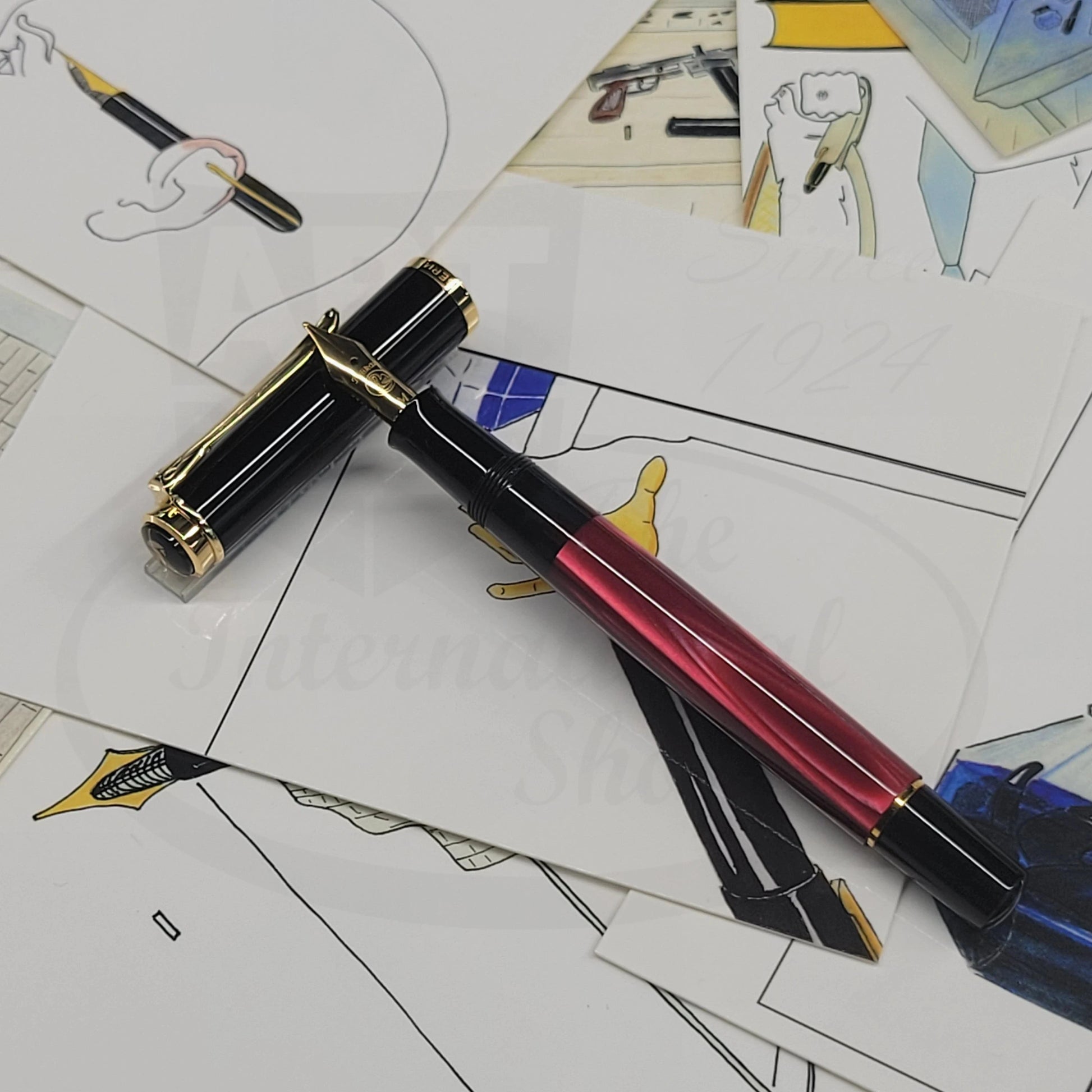 Pelikan Classic M200 827379 resin fountain pen with red marbled barrel and black cap with gold accents