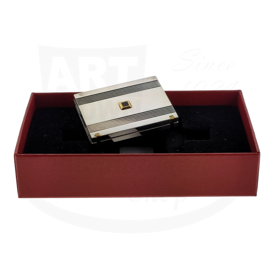 Vintage S.T. Dupont pocket photo holder in palladium with gold and lacquer accents. The holder is folded shut, sitting inside the gift box.