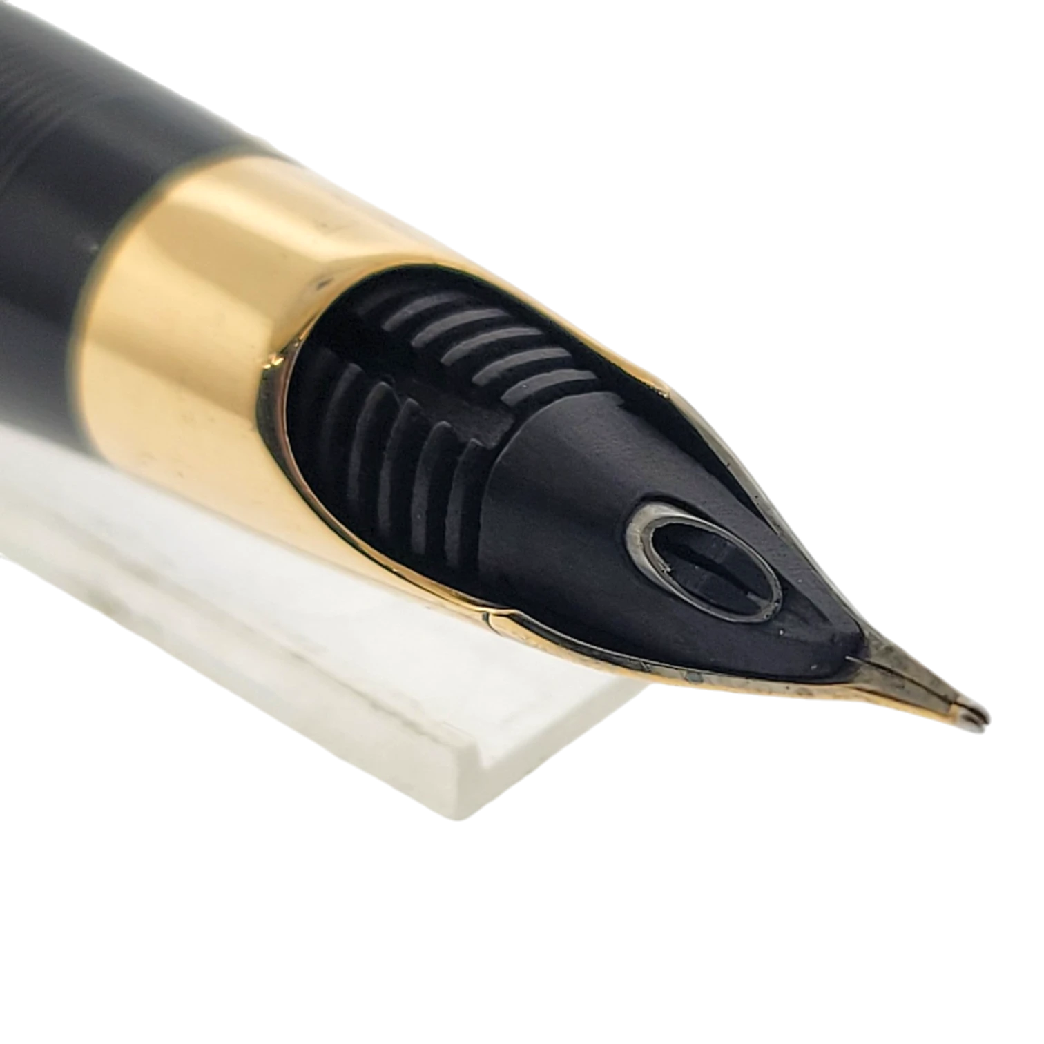 Sheaffer Snorkel fountain pen nib section with black feed, solid 14K gold trim, and unique snorkel filling system tip