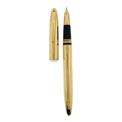 Sheaffer Snorkel fountain pen with solid 14K gold body featuring vertical line engraving and gold nib visible