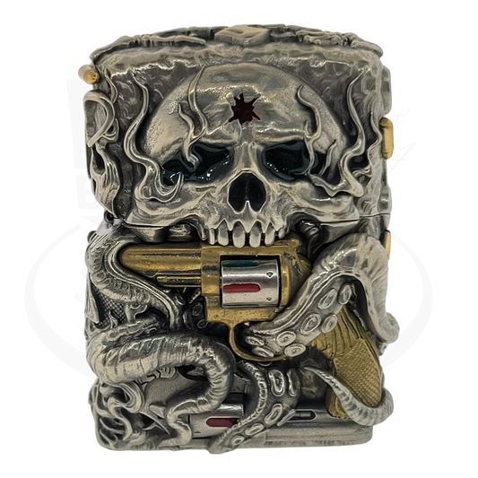 Zippo Skull with Revolver Lighter featuring antique brass casing with detailed skull engraving and rotating revolver cylinder design on weathered metallic finish