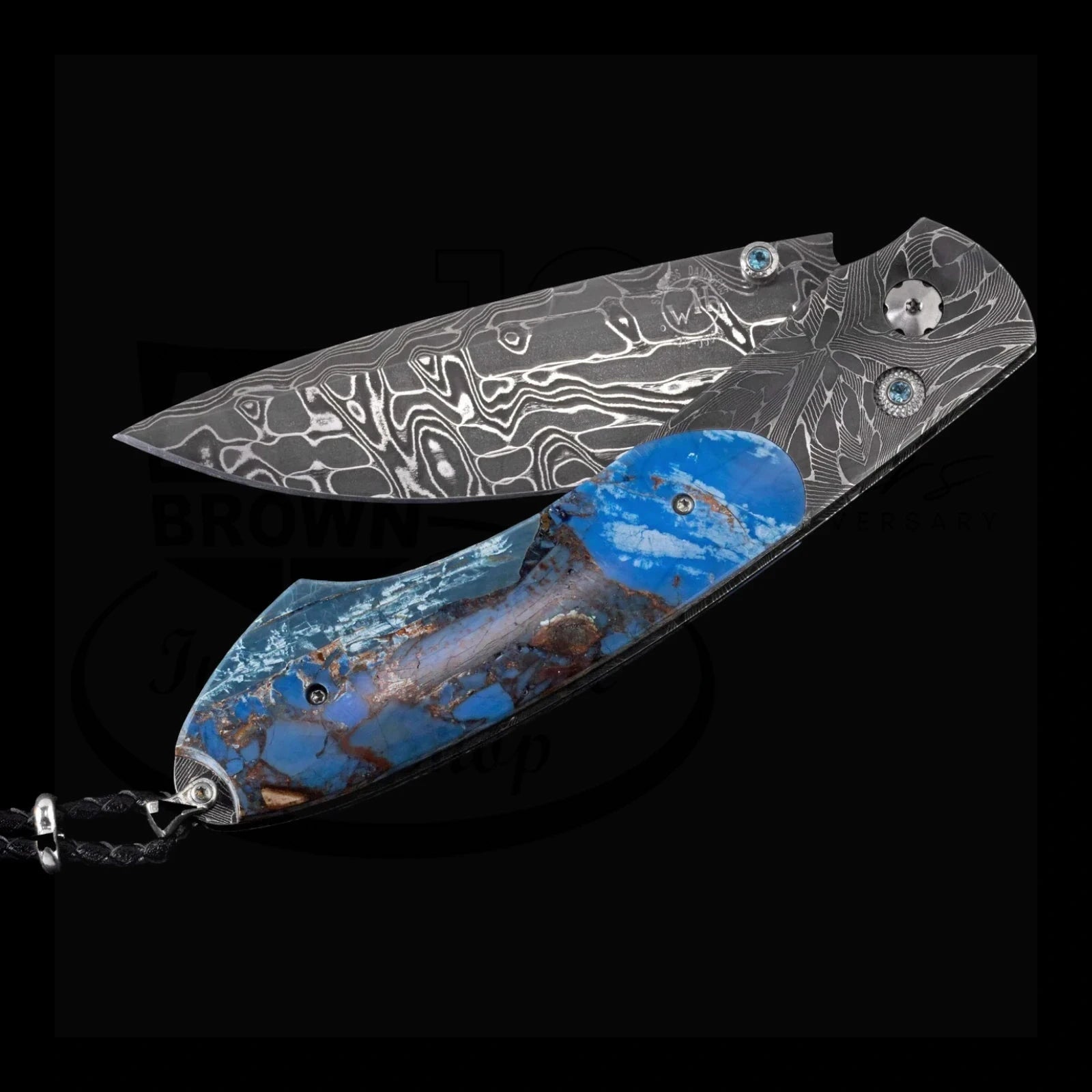 William Henry B12 Blue Fusion spearpoint knife with patterned Damascus steel blade and blue mammoth tusk and resin handle