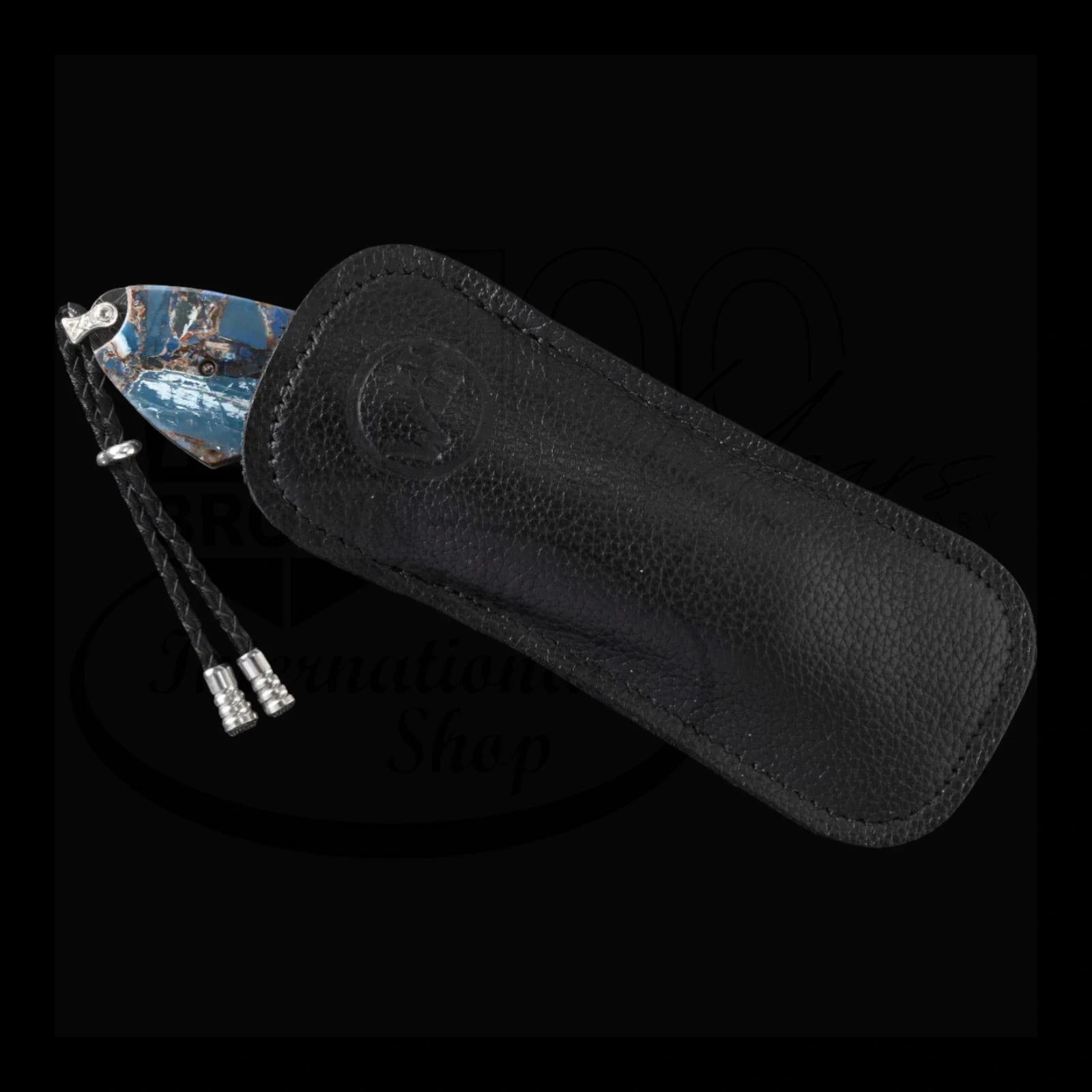 William Henry B12 Blue Fusion Spearpoint with blue fossilized mammoth tusk blade and black leather sheath with braided leather pull tabs