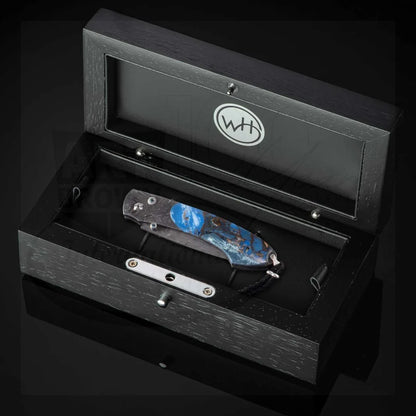 William Henry B12 Blue Fusion Spearpoint folding knife with blue resin and Damascus steel handle in black presentation box