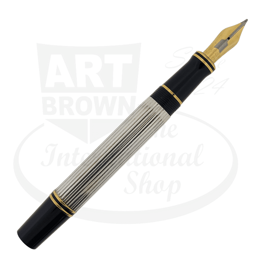 Parker Duofold Centennial Sterling Silver fountain pen with black resin ends, gold-plated trim, and 18K broad nib featuring ribbed silver barrel design