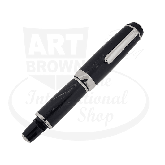 Dayacom Wood Dark Brown Medium Fountain Pen with silver trim accents, barrel shows visible wear and cracks, black nib visible at tip