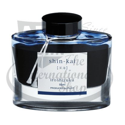 Pilot Iroshizuku glass bottle ink in shin-kai blue-black, 50ml capacity with black screw cap and white label showing Japanese characters