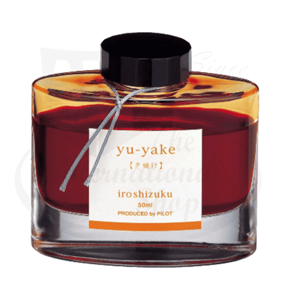 Pilot Iroshizuku yu-yake glass ink bottle 50ml, featuring deep orange-red liquid with black cap and white label, traditional Japanese calligraphy design